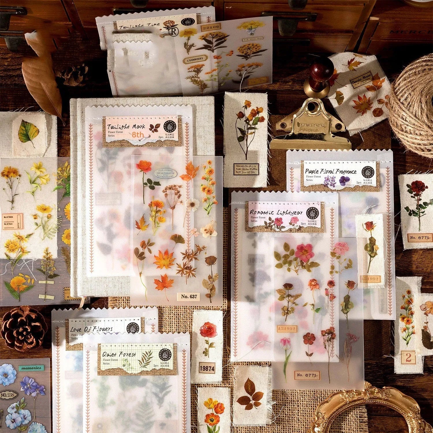 Huazhisen art sticker material pack showing printed transfer paper and cotton linen sheets in forest and romantic designs.