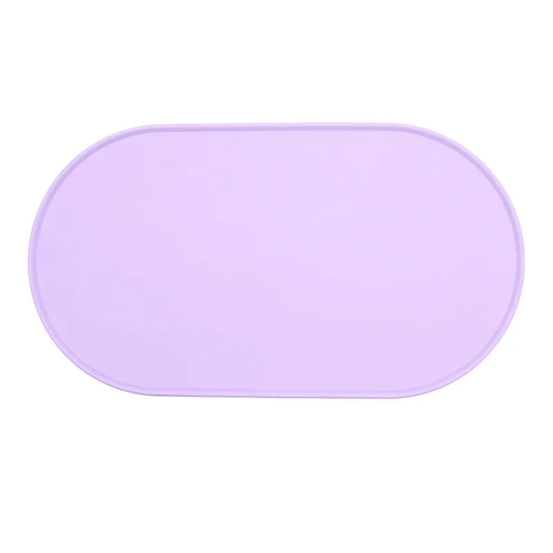 Silicone waterproof placemat for cat food and water bowls in green, beige, black, or purple.