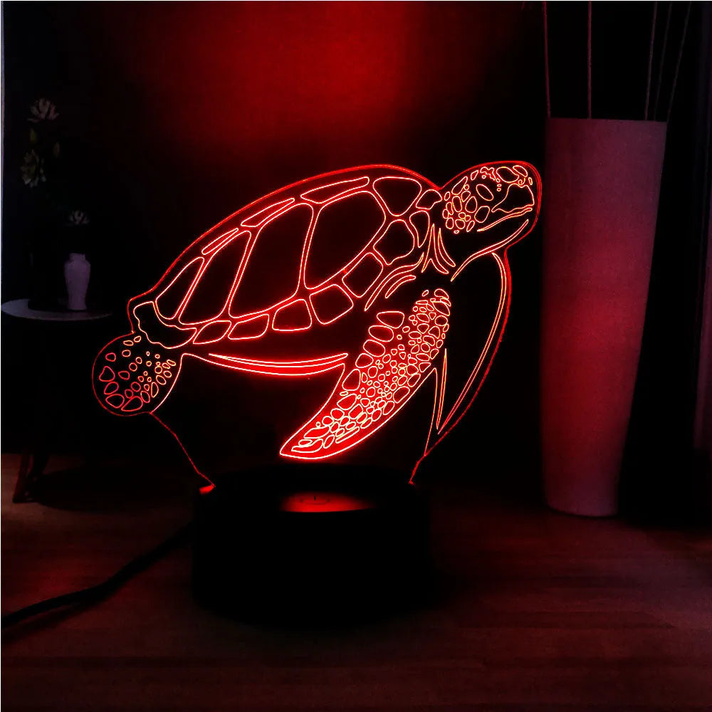 3D clear acrylic turtle-shaped LED night light showing colour changing illumination.