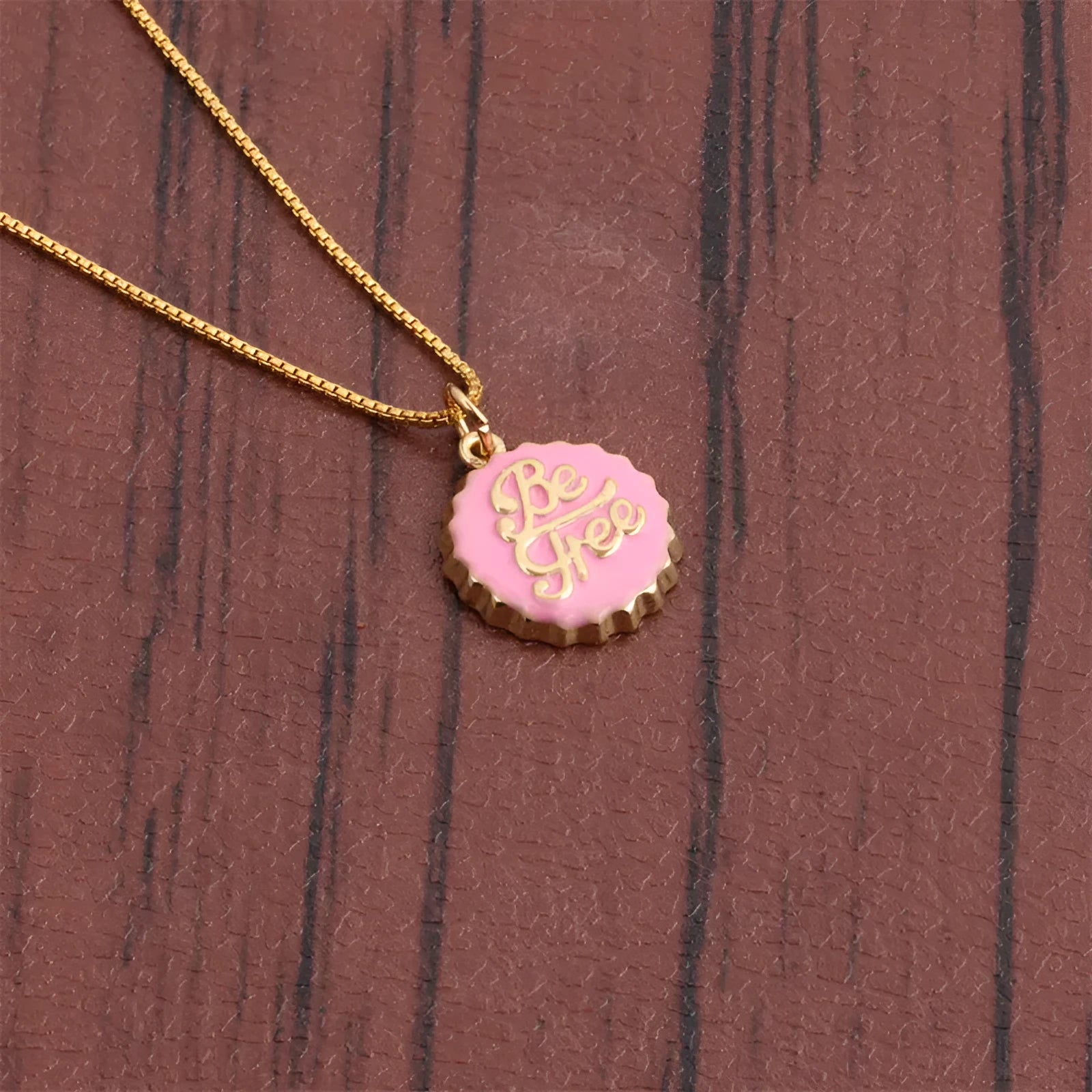 Copper 18K gold electroplated be free bottle cap pendant on a 40cm box chain necklace.