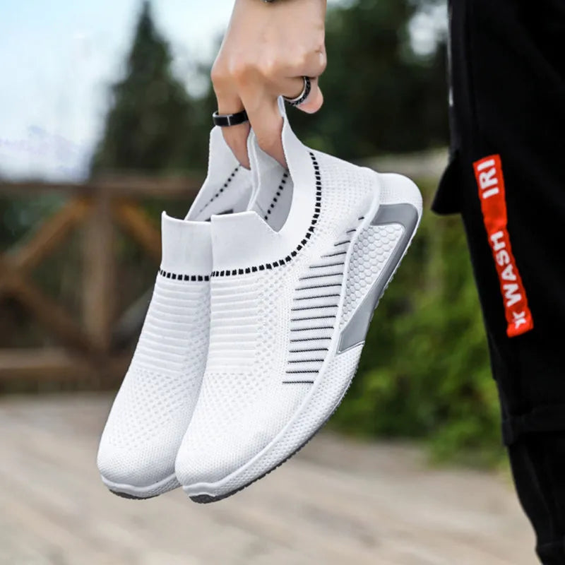 Men's black and white striped mesh slip-on sneakers with lace-up front on a white background