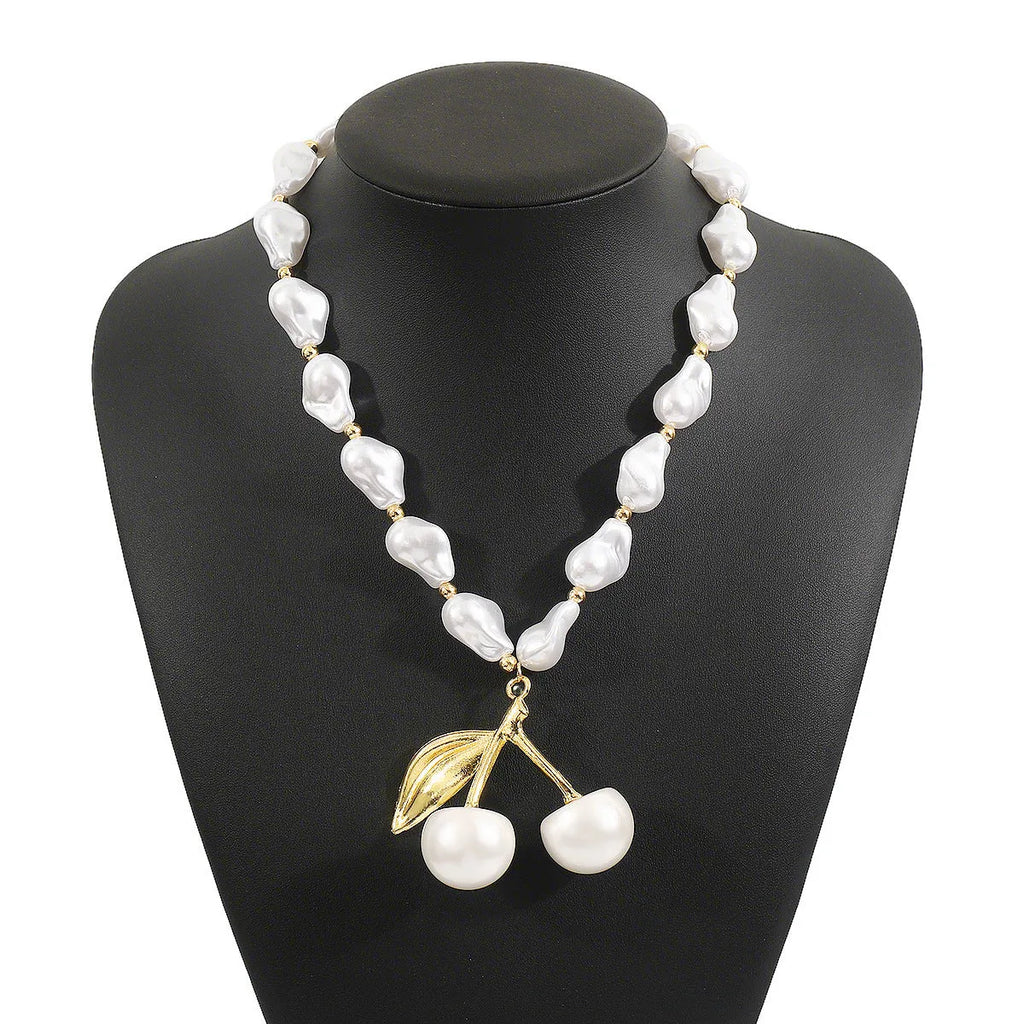 Women's adjustable necklace with geometric cherry pendant on gold electroplated chain