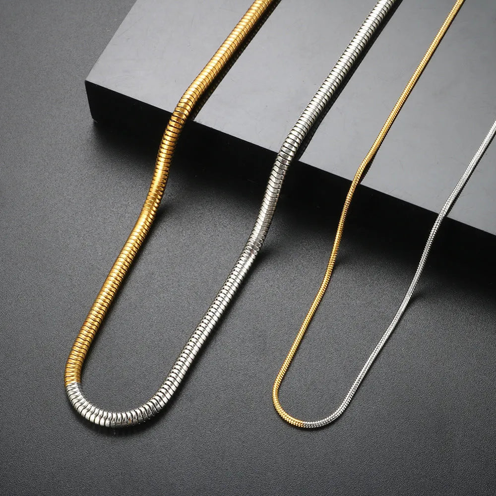 Golden tone stainless steel snake bones chain necklace with 3mm thickness and geometric pattern
