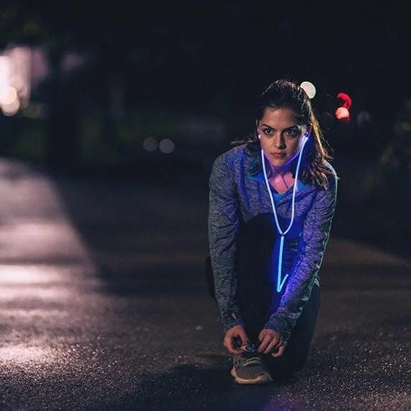 Blue LED light-up earphones with 3.5mm plug and inline remote microphone for iPhone and Android phones.