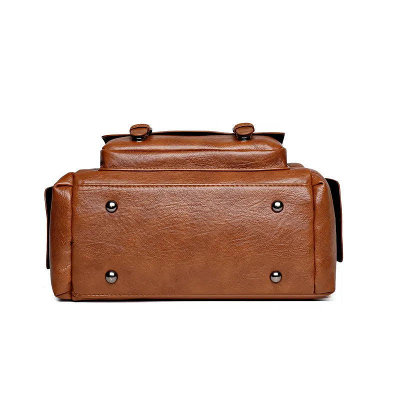 Vintage messenger bag in horizontal square shape with contrast stitching, shown in available colours