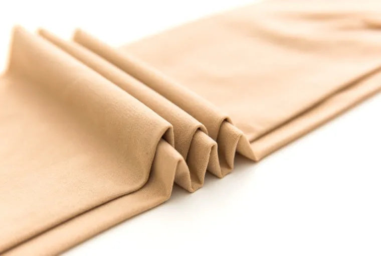 Beige and black women's stovepipe shaping socks for hips and abdomen, made from polyester.