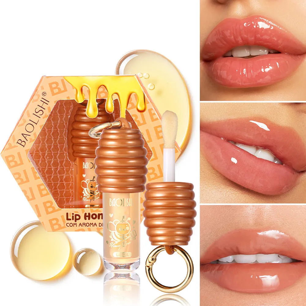 Honey-coloured lip gloss with keychain attachment for portable carrying on bags
