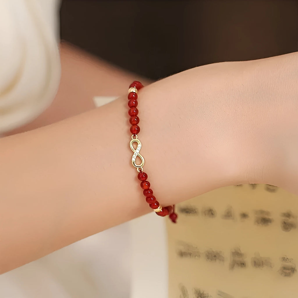 Hand-woven red agate bracelet with diamond-shaped beads and ethnic woven patterns