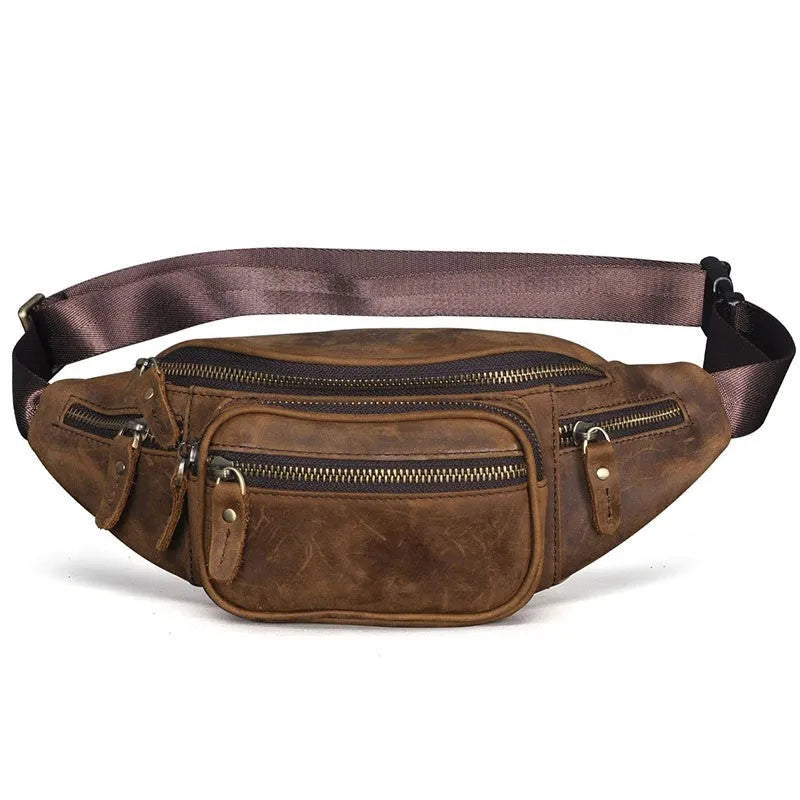 Brown cowhide leather messenger bag with a single shoulder strap, shown closed.