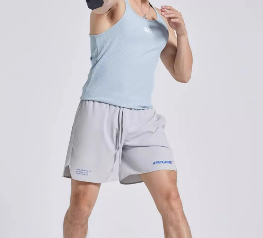 Men's blue training shorts with moisture-wicking fabric on a grey background.
