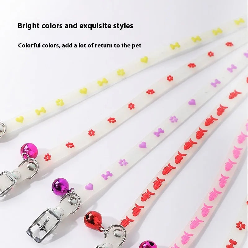 Cat luminous collar with adjustable silicone strap and metal bell showing paw print pattern