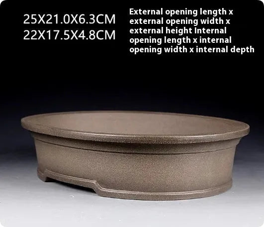 Handmade antique oval purple sand ceramic bonsai pot measuring 25cm long by 21cm wide by 6.3cm high