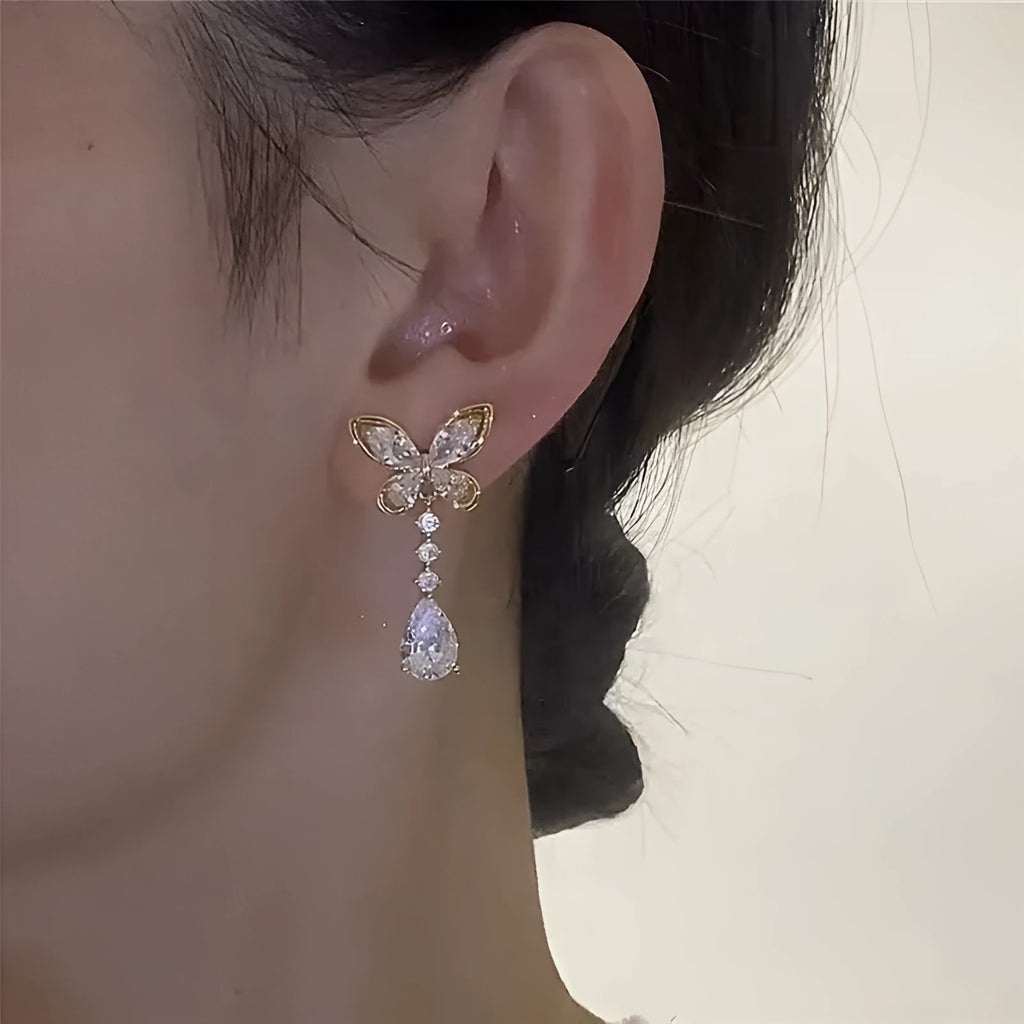 Platinum colour bow stud earrings with zinc alloy construction and electroplating treatment