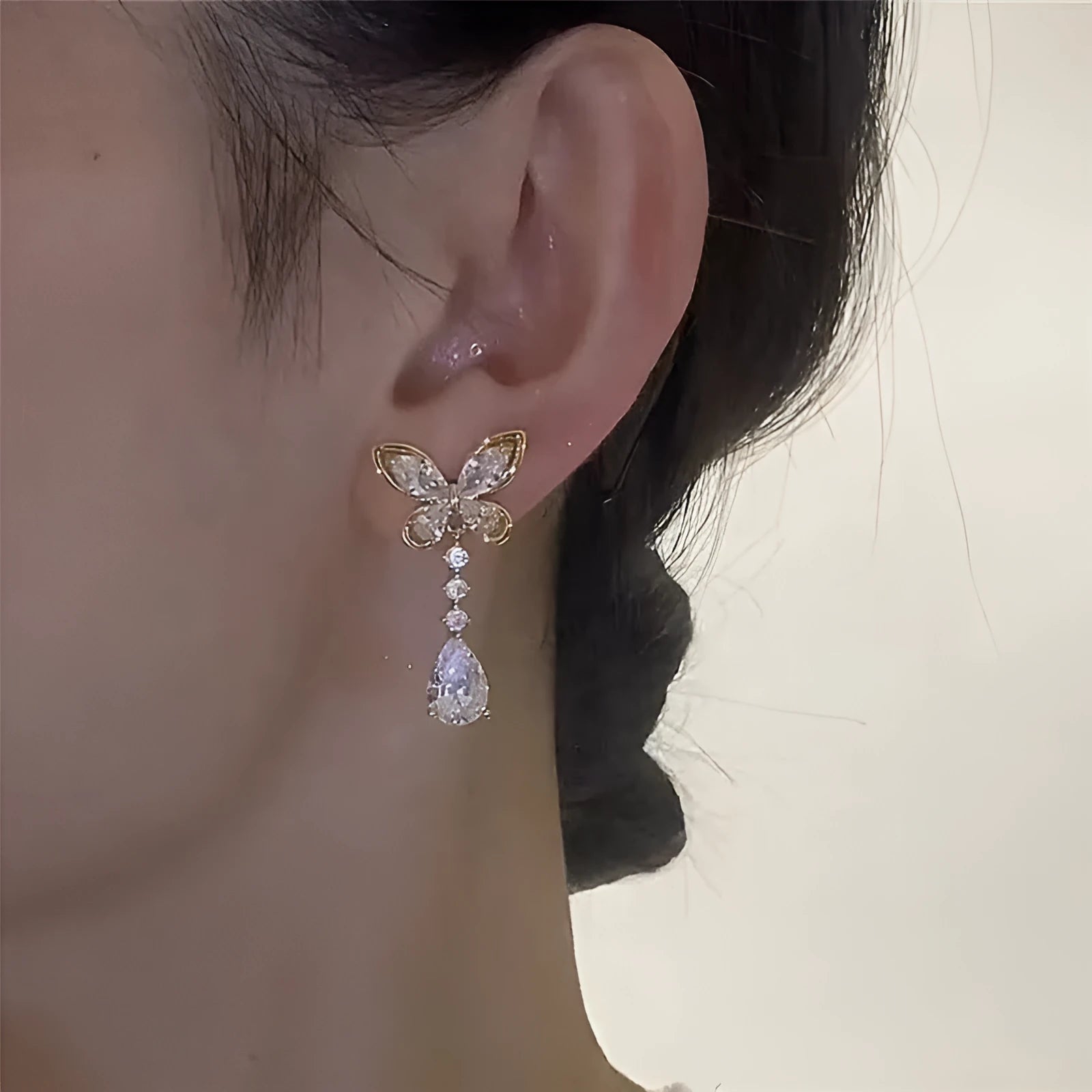 Platinum colour bow stud earrings with zinc alloy construction and electroplating treatment