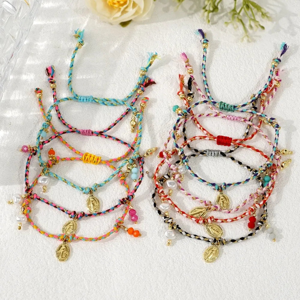 Close-up of a hand-woven colourful braided rope bracelet for women featuring an adjustable carrying strap tag closure.