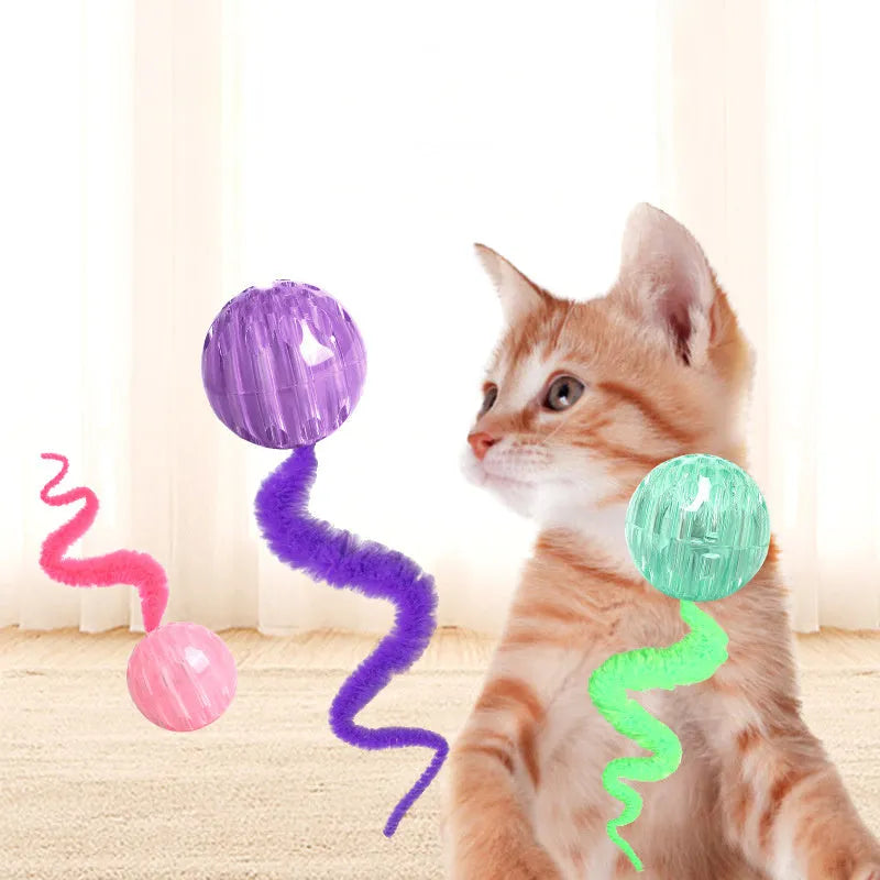 Interactive bouncy ball cat toy with soft plush worm tail in green, pink, or purple colours