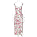 Women's long blue dress with lace flowers print, featuring suspender straps and a thigh-high slit.