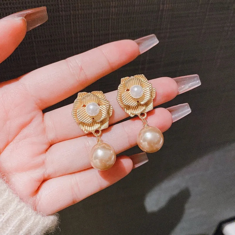 Gold Hong Kong style flower stud earrings with pearl rose design and ice flower pattern