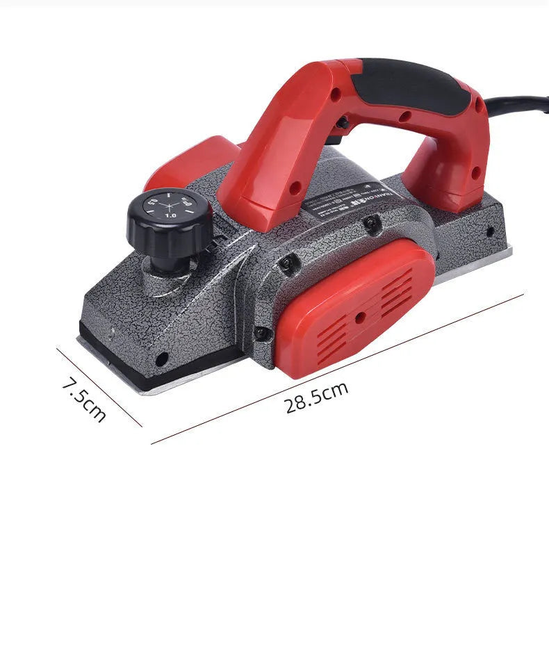 Red desktop electric planer with aluminium housing for woodworking showing 82mm planing width