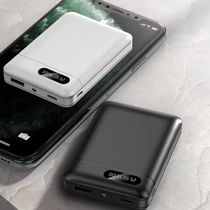 Black and white portable power bank showing USB ports and dimensions 92x63x23mm