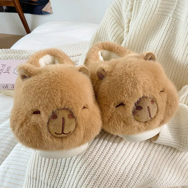 Light brown women's winter slippers with plush cotton upper and cartoon pattern.