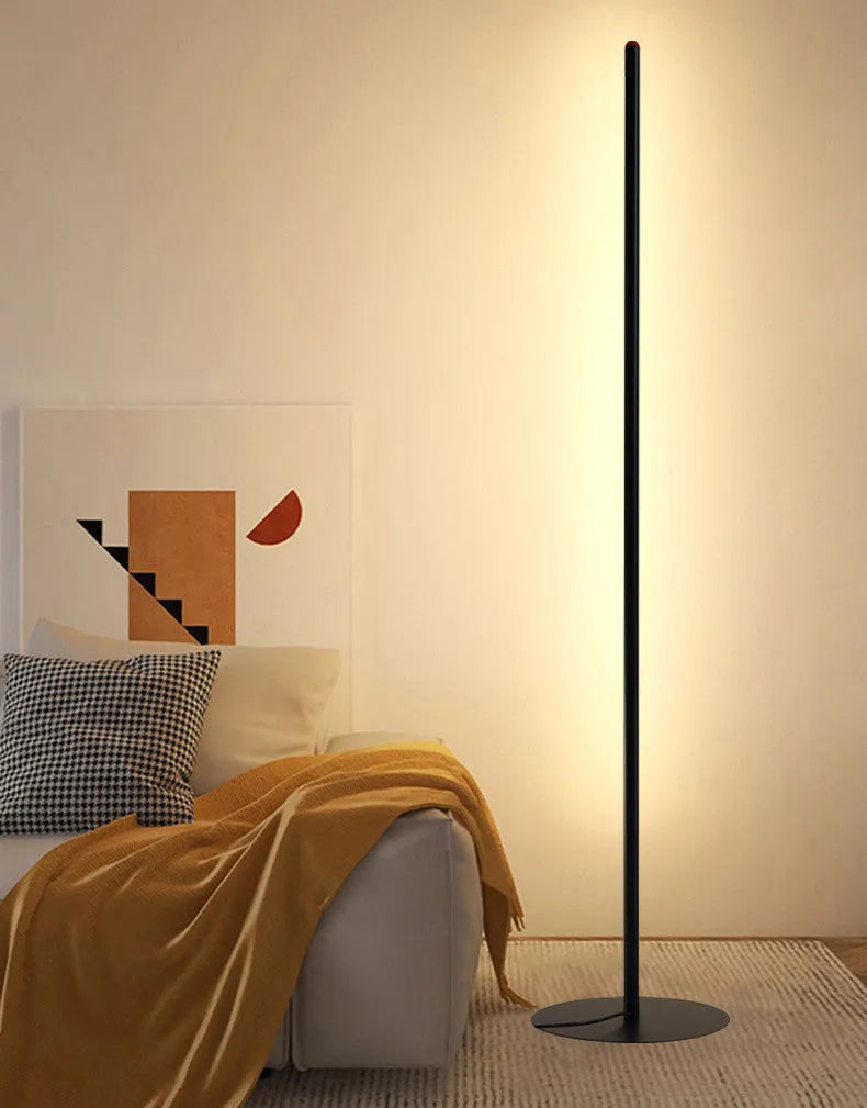 Tall, slim aluminium alloy vertical floor lamp with a LED light source on a modern stand.