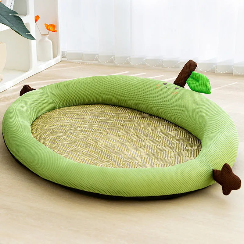 Green pet cooling mat with raised fruit backrest for dogs or cats on a wooden floor