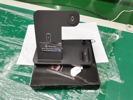 Folding 4-in-1 wireless charger in space grey, shown open as a vertical stand and closed for travel.
