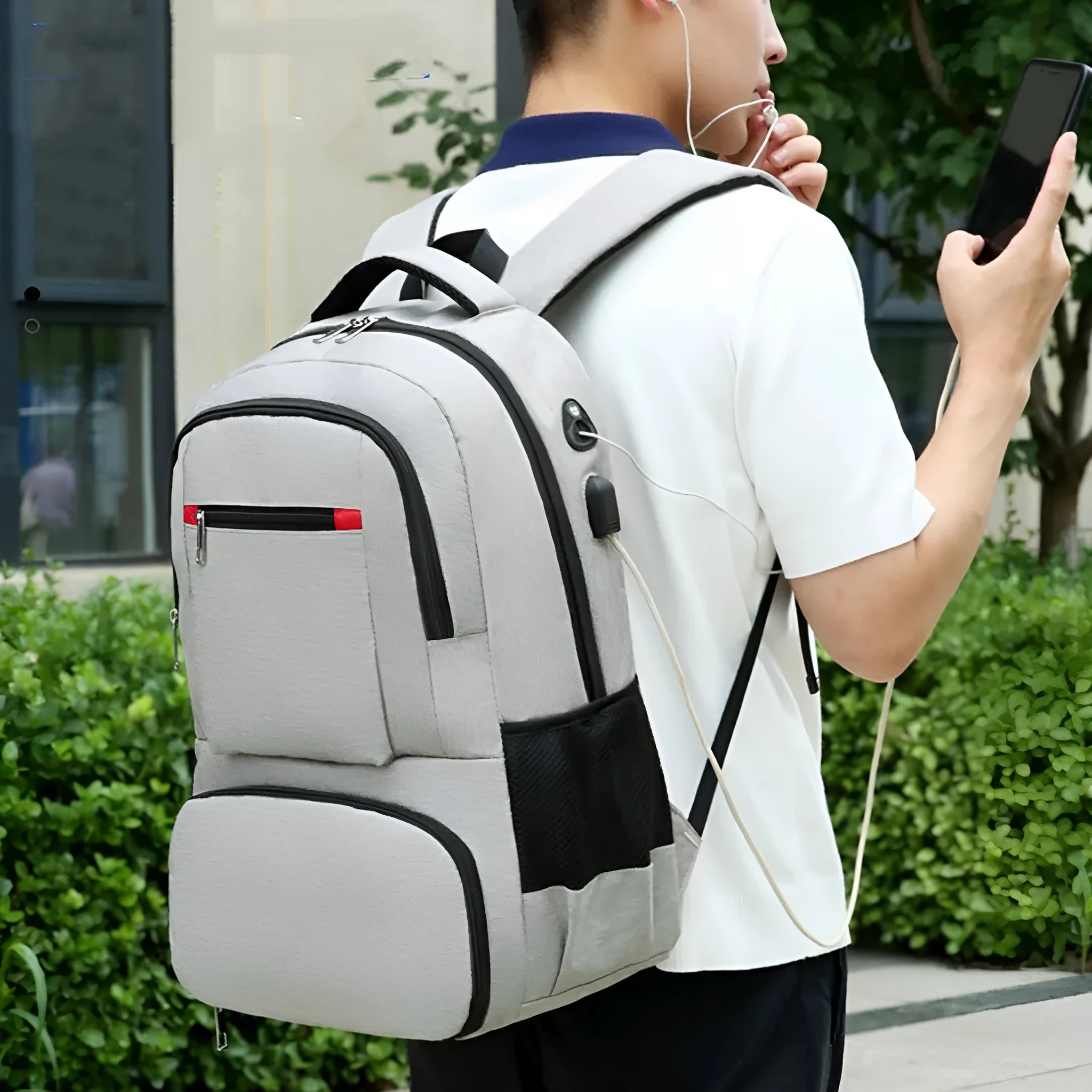 Light grey Oxford cloth insulated backpack with curved shoulder straps, shown with compartments open.