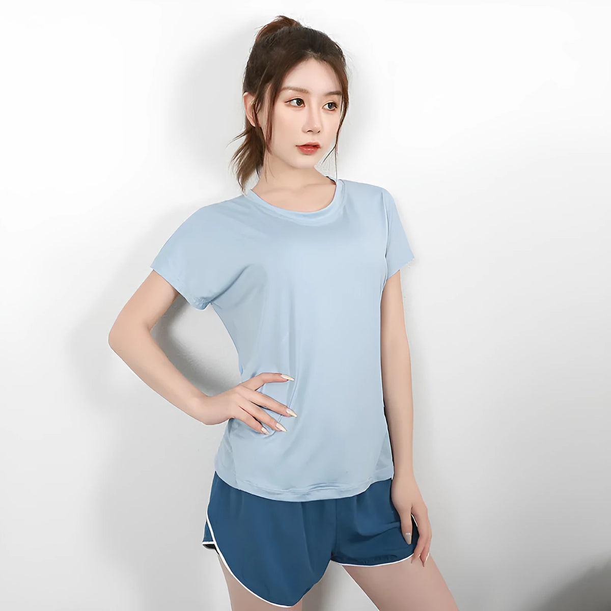 Women's polyester sports T-shirt short sleeve in pink colour for running fitness activities