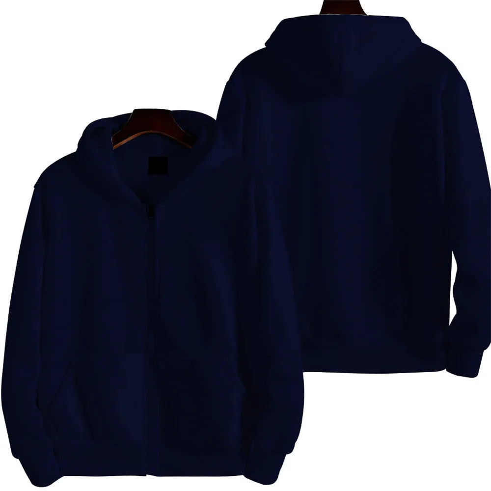 Man wearing a loose-fit solid colour zip-up sports jacket in a casual setting.