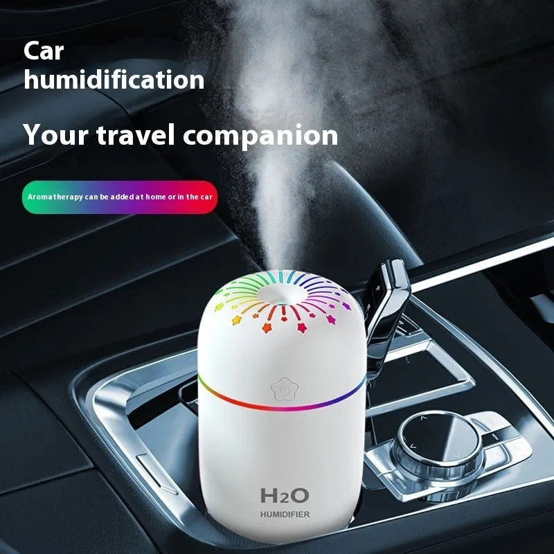 USB mini humidifier with fireworks design in white, pink, or green colours showing compact 75mm size