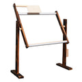 Vertical pine wood embroidery frame with height adjustment on desktop
