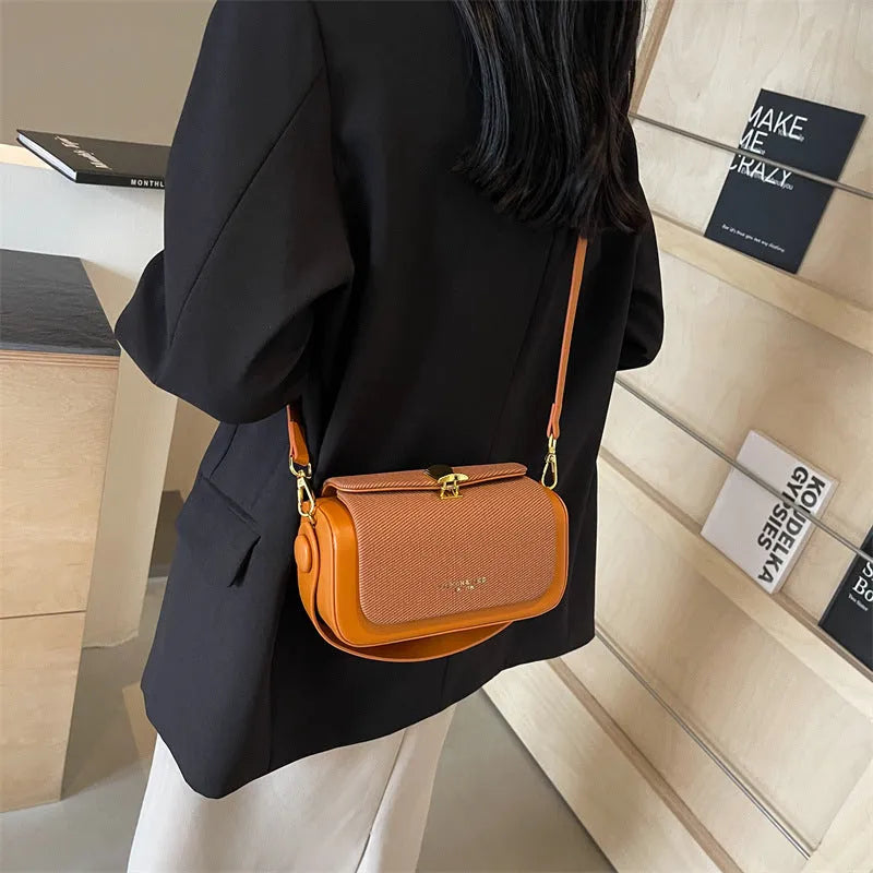 Women's PU leather crossbody messenger bag in a horizontal square shape with a single strap.
