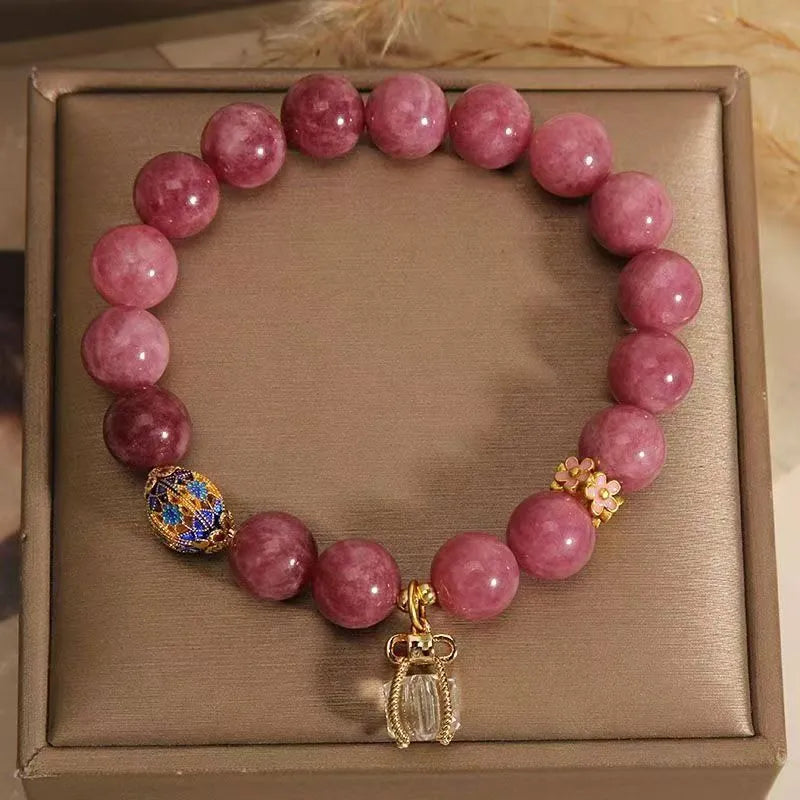 Pink lotus tassel bracelet with natural stone beads and crystal accents