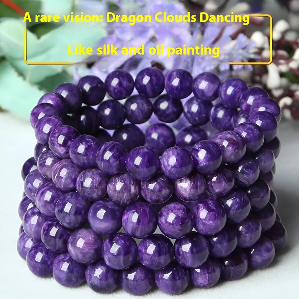 Natural transparent charoite crystal bracelet with platinum fastening on a wrist.