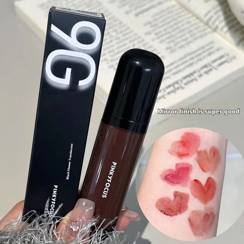 Black shiny Mirror Lip Lacquer tube with six swatches showing matte shades from tomato to sweet potato.