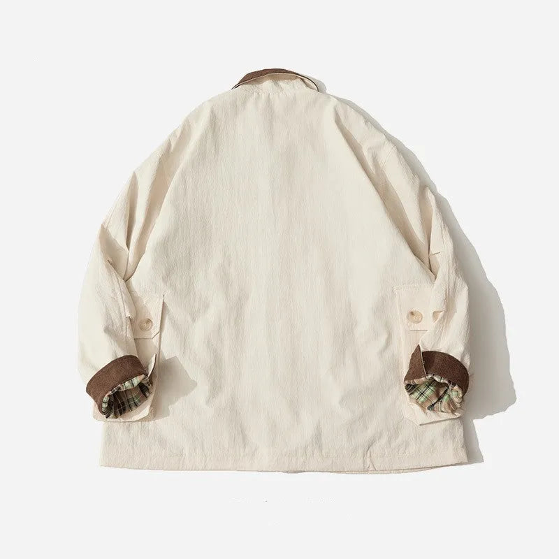 Green and apricot coloured casual jacket with side seam pockets on a mannequin
