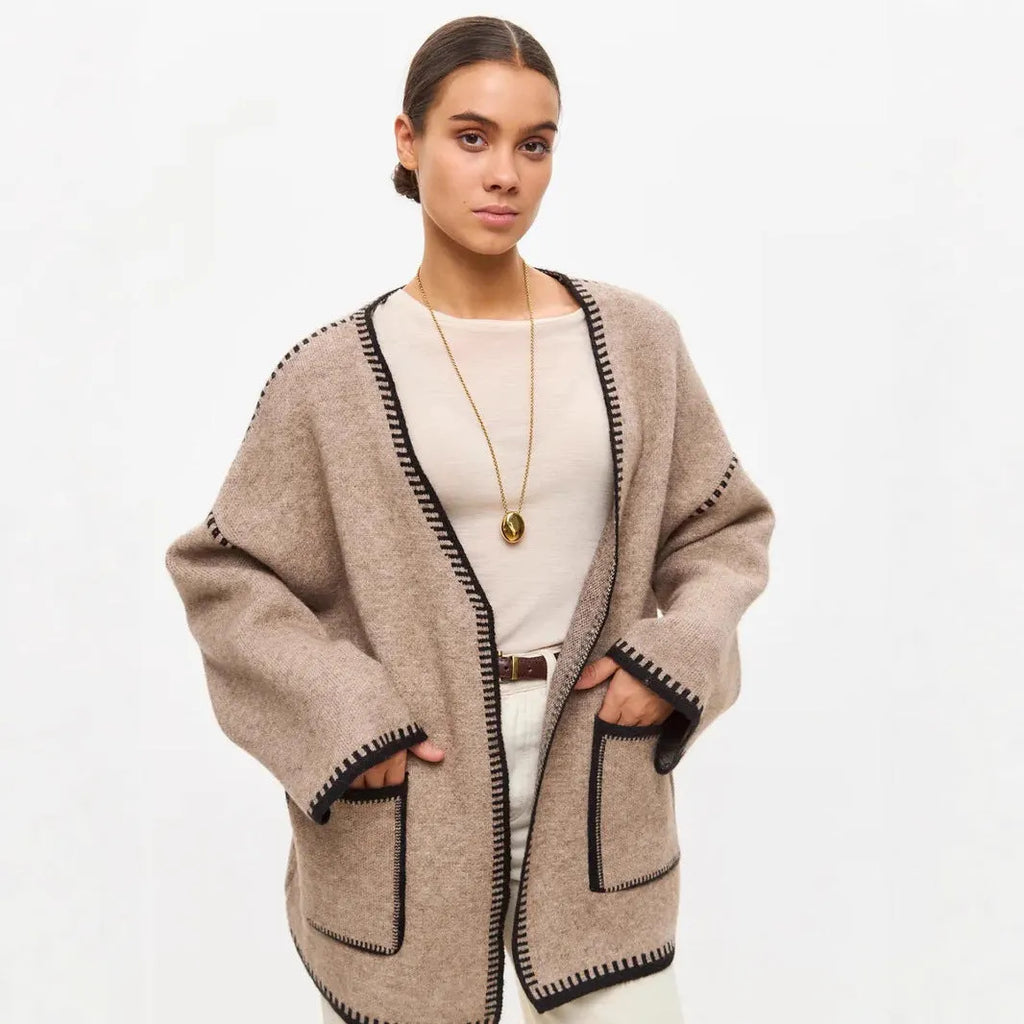 Loose fit knitted cardigan with lace-up front detail in thick imitation cashmere cotton fabric.