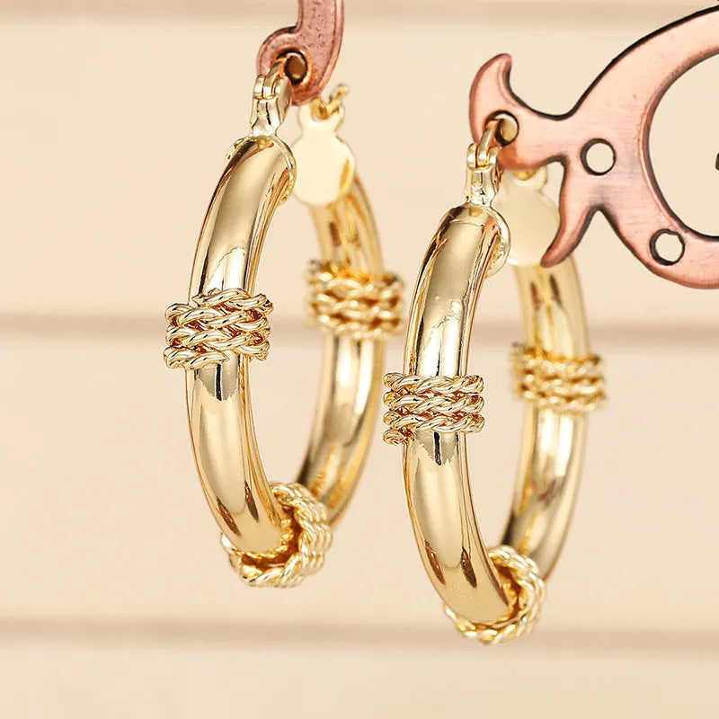 Golden geometric copper earring clip with ring and line design for women