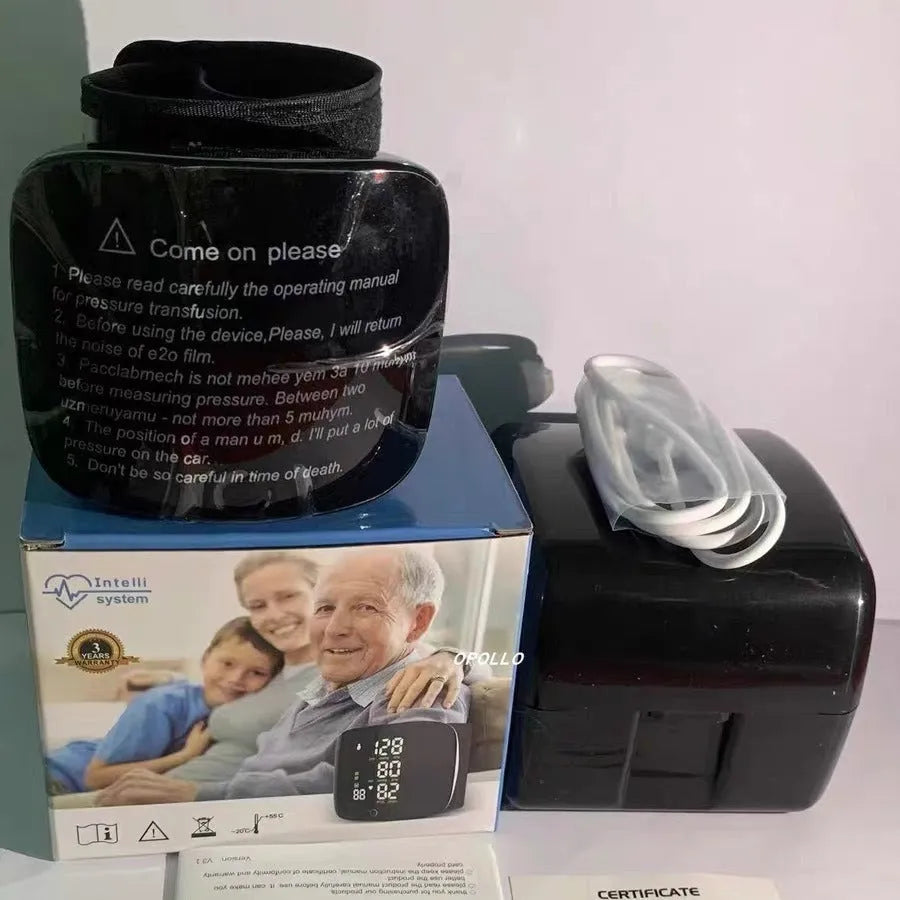 Black wrist blood pressure monitor with digital display and USB charging cable