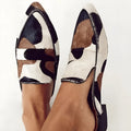 Women's black and white apricot imitation horse hair retro pointed-toe low heel shoes with suede upper.