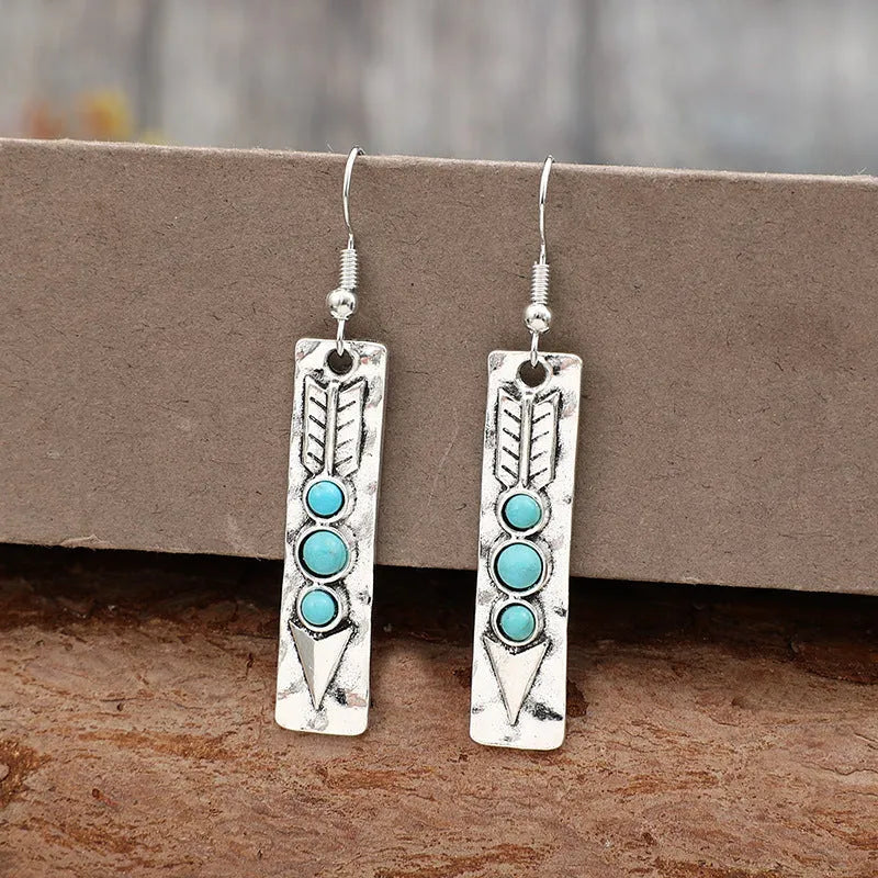 Long strip silver earrings with geometric shape and turquoise colour inlay