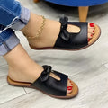 Ladies black fish mouth sandals with a bow decoration on the upper.