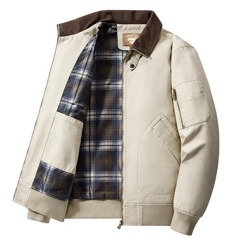Men's beige washed cotton baseball style flight jacket on a hanger, showing classic design.