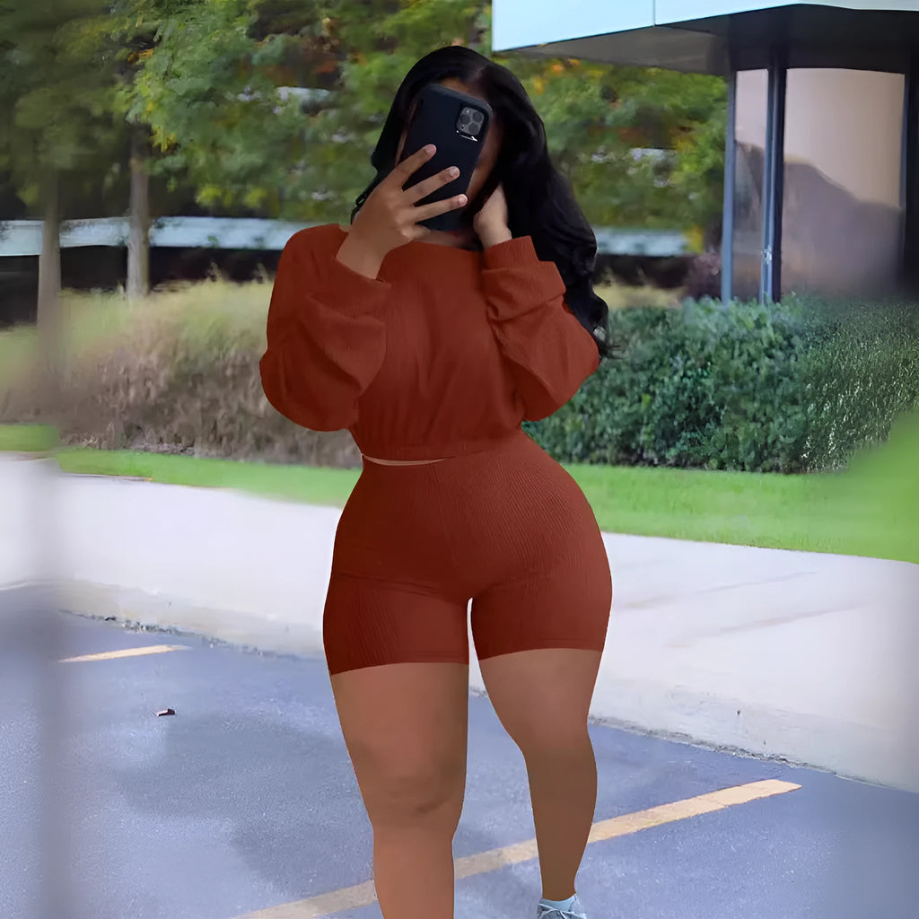 Women's off-shoulder two-piece set with long sleeves and matching shorts in solid colour