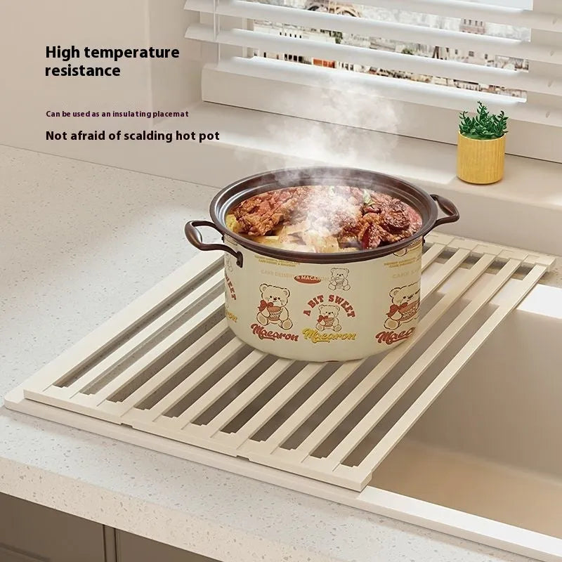 Milky white tri-fold stainless steel kitchen draining rack shown extended for use and folded for storage