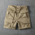 Men's straight-leg cargo shorts in Army Green made from micro-elastic cotton fabric with multiple pockets.