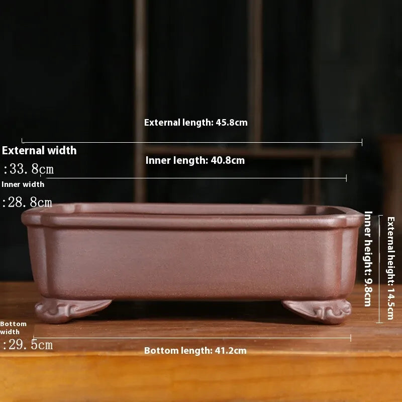 Purple sand rectangular bonsai planter with corner cutting design on wooden surface