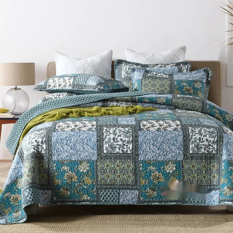 Quilted cotton bed cover set with printed pattern including bedspread and two pillowcases